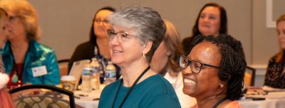 attendees at Women Impact Virginia Summit 2023 in Roanoke, VA enjoy a keynote address
